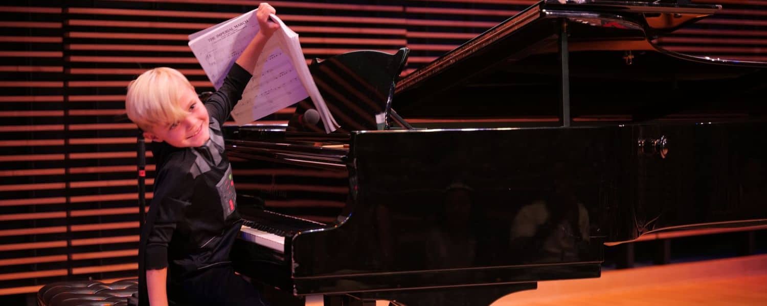 kid playing piano